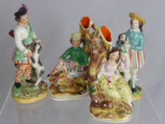 A Pair of Staffordshire Style Figures.in traditional Highland costume, est height 18 cms, together