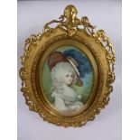An Oval Portrait Miniature of a Lady, depicting a lady in a feather trimmed hat, the miniature in