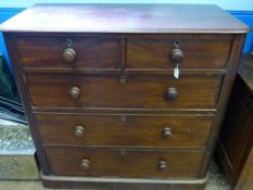 A Victorian Mahogany Chest of Drawers, having two short and three graduated long drawers supported