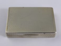 A Solid Silver Match Box Vesta Case, the engine turned box London hallmarked dated 1921, mm A W H,