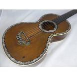 An Antique Rosewood and Mother of Pearl Guitar, having rosewood back and sides and ivory banding and