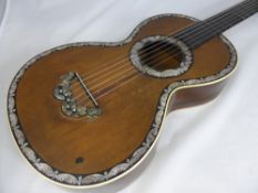 An Antique Rosewood and Mother of Pearl Guitar, having rosewood back and sides and ivory banding and