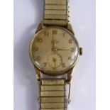 A gentleman's Smiths 9 ct gold wristwatch having a gold coloured dial with minute hand.