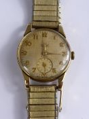 A gentleman's Smiths 9 ct gold wristwatch having a gold coloured dial with minute hand.