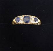 A lady's 18 ct gold diamond and sapphire ring. 4 x old cut dias. 2.5 pts each, centre saph 5.3 x 4.2