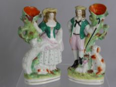 A Pair of 19th Century Staffordshire Spill Vases, depicting a shepherd and shepherdess, est height