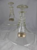 A Pair of Antique Clear Glass Ships Decanters and Stoppers, each with triple ring neck, height
