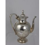 A Solid Silver Victorian Tea Pot, having floral engraved body with central cartouche with engraved