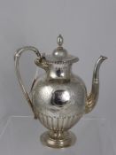 A Solid Silver Victorian Tea Pot, having floral engraved body with central cartouche with engraved