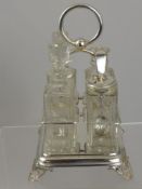 A collection of assorted silver plate including a cruet set, a cut glass pickle jar, tea caddy and