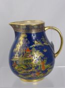 A Crown Devon Jug, the jug having a cobalt blue ground with Chinese village scene to back and front,