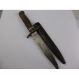 A Vintage Wooden Handle Continental Style Bowie Knife in metal sheath. The blade hilt engraved