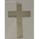 A silver metal box in the form of a cross with hinged lid, est. 9.5 x 6 cms.