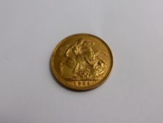 An Edward VII 1904 full gold sovereign  (good condition)