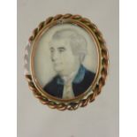 A miniature of a 19th century gentleman painted on ivory in a small brass frame, est. 5 x 6 cms.