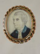 A miniature of a 19th century gentleman painted on ivory in a small brass frame, est. 5 x 6 cms.