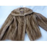 A Lady's Mink Short Cape, size medium.