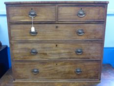 A Victorian Mahogany Chest of Drawers, having two short and three graduated long drawers with