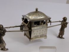 An Antique Chinese Silver Study of Two Figures, carrying a sedan chair, character marks to base.