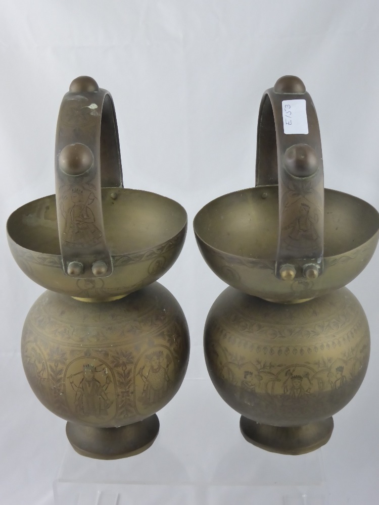Two Indian Brass Water Vessels, hand engraved with various gods, est, height 40 cms. including the