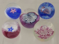 Five Caithness Glass Paperweights, including Fleur (Pink), Millennium Miniature, Fleur (Blue),