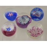 Five Caithness Glass Paperweights, including Fleur (Pink), Millennium Miniature, Fleur (Blue),