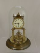 A Brass Anniversary Clock, with cream enamel face stamped DRGM No 403658 under a glass dome.