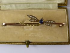 A Lady's Gold Seed Pearl Dragon Fly Brooch, the dragon fly set with rose cut diamond eyes, and the