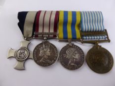 A Group of Four Medals, including DSC., Malaya, Korea, (x 2), the 925 hallmarked cross engraved Lt