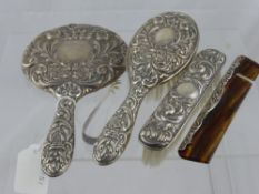 A solid silver dressing table set comprising hair and clothes brushes, mirror and comb, Birmingham