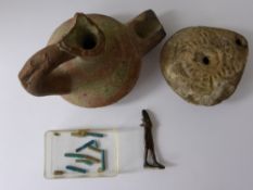 Four Ancient Artefact's, including a terracotta vessel and an oil lamp, together with a bronze