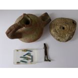 Four Ancient Artefact's, including a terracotta vessel and an oil lamp, together with a bronze