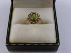 A Lady's 9ct  Peridot and Seed Pearl Cluster Ring, size M together with a sapphire and diamond