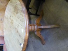 A round pine kitchen table on a bulbous turned centre column and four splayed feet, approx. 90