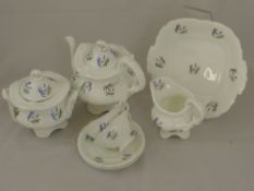 A Part 19th Century Blue Flower Porcelain Tea Set, comprising teapot, sugar bowl, milk jug, ten
