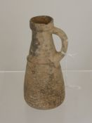 A Small Roman Terracotta Jug, with ribbed design to the body, 16 cms high.