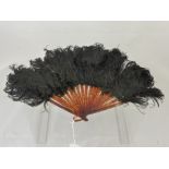 An Early 20th Century Lady's Fan, tortoiseshell effect sticks with Emu feathers.