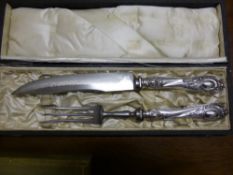 A Boxed Carving Set with Continental silver handles together with four Portuguese silver forks and a