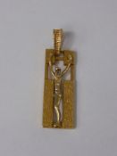 A 14ct Yellow and White Gold Crucifix approx wt 5.8 gms together with an 18ct charm in the form of a