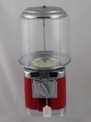 A vintage gob stopper sweet dispenser together with a pair of antlers (2)