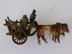 An Antique Cold Painted Bronze Study of Oxen, pulling a cart, foundry mark.