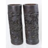 A pair of Chinese bamboo carved pots decorated with riverside scenes, est. height 33 cms.