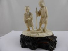 A Japanese Circa 1900 Okimono, depicting a Father and Son.