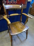 An antique elm kitchen armchair being bar backed.