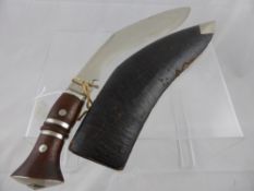 An Antique Chrome Bladed Khukuri Knife. The knife with leather covered sheath and having chrome