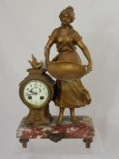 A Victorian marble based mantle clock depicting a farm girl, the clock having a painted porcelain