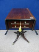 An Edwardian mahogany drop leaf occasional table, being fitted with two drawers with turned