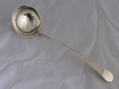 A solid silver Georgian punch ladle.