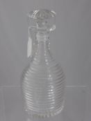 A Ribbed Glass Decanter with mushroom shaped stopper.