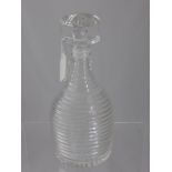 A Ribbed Glass Decanter with mushroom shaped stopper.